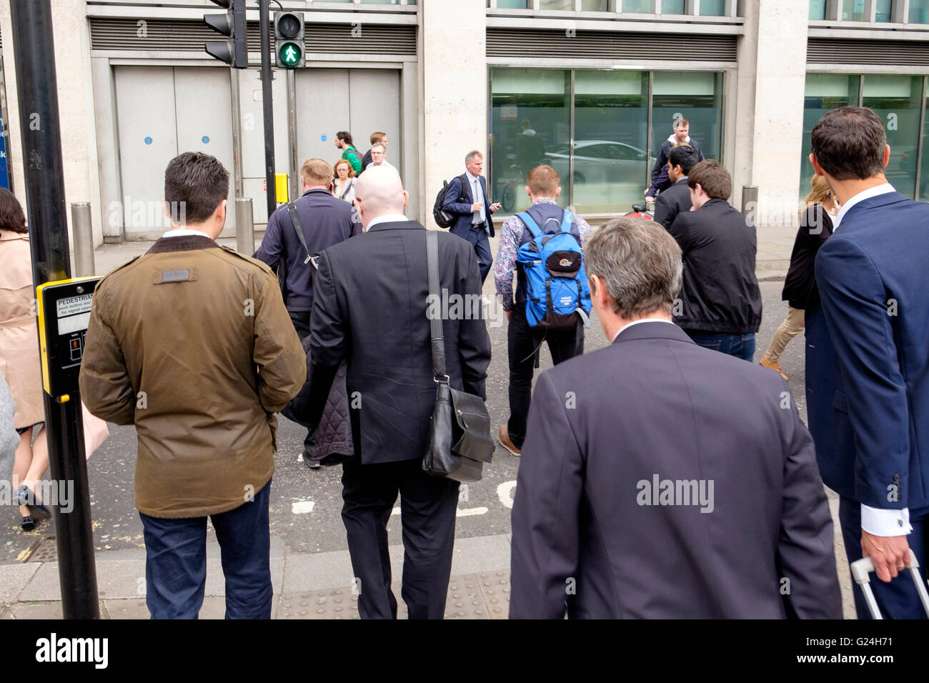 Business people in a variety of clothing heading home at the end of a day in the City of London Stock Photo