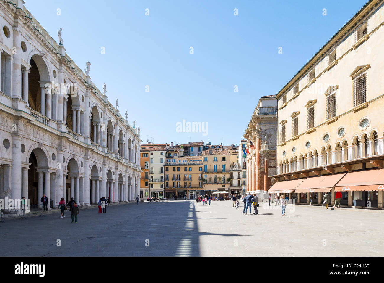 Vicenza,Italy-April 3,2015:people walk and admire  the famous town square  named Piazza dei Signor in Vicenza, Italy during a su Stock Photo