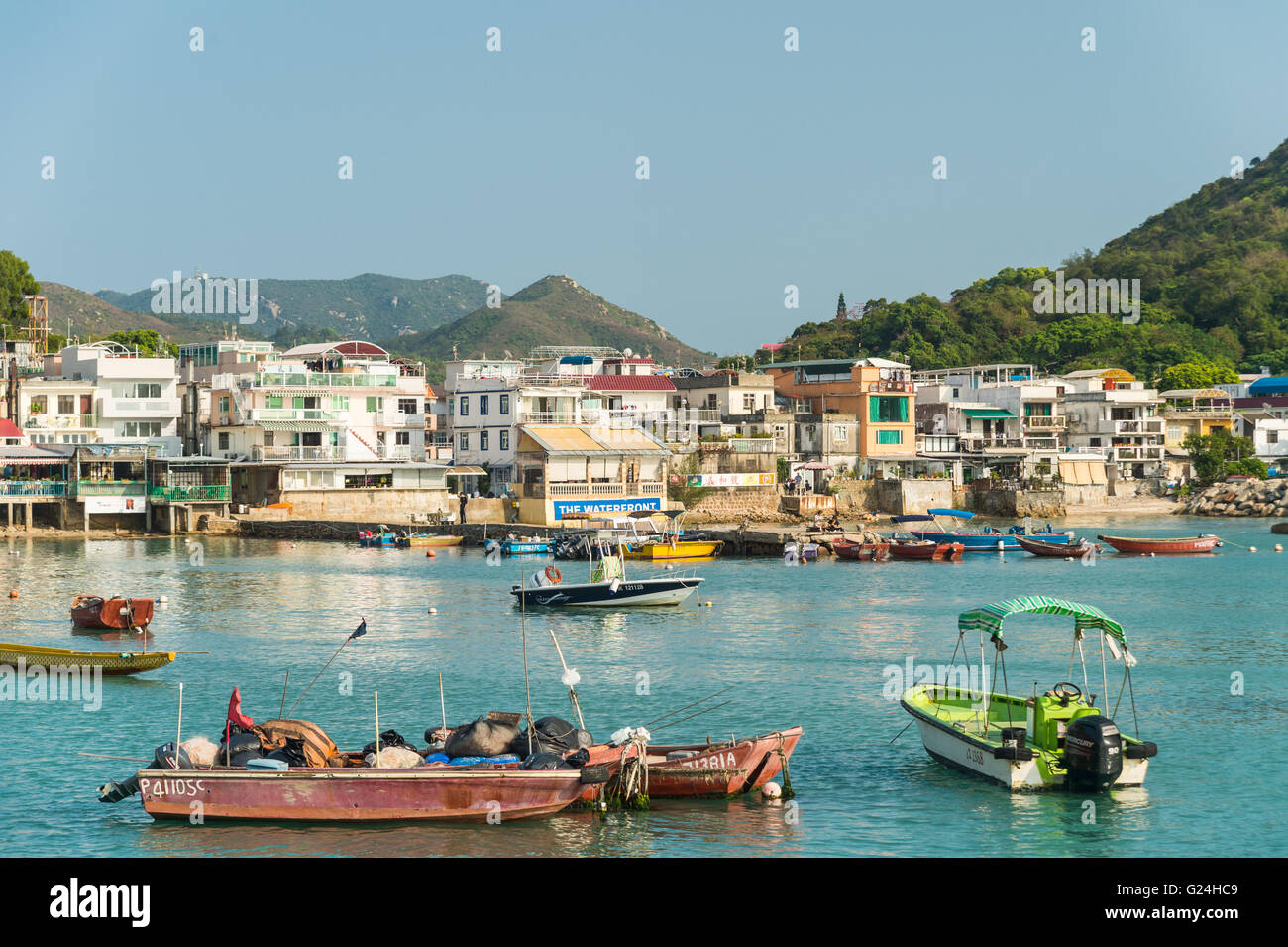 Harbour and boats in Yung Shue Wan on Lamma Island, Hong Kong Stock Photo