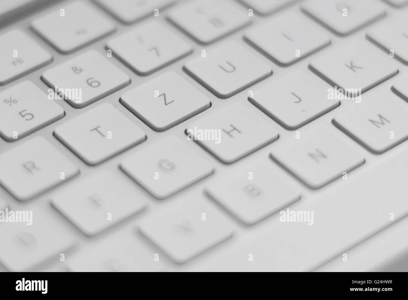 closeup of a modern white, silver keyboard macro Stock Photo