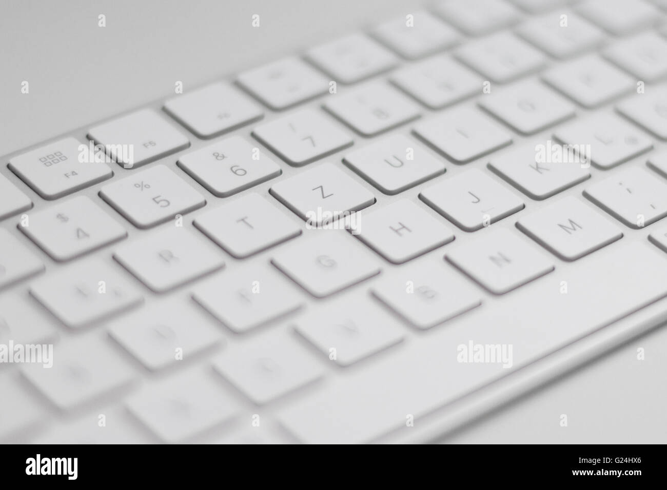 closeup of a modern white, silver keyboard macro Stock Photo