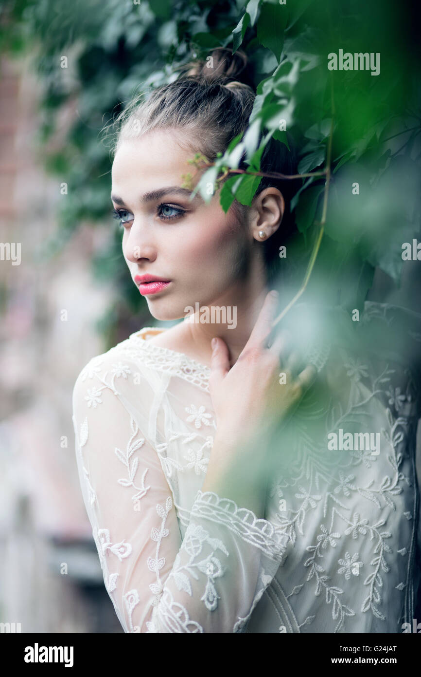 Portrait of a beautiful bride in the green bush Stock Photo Alamy