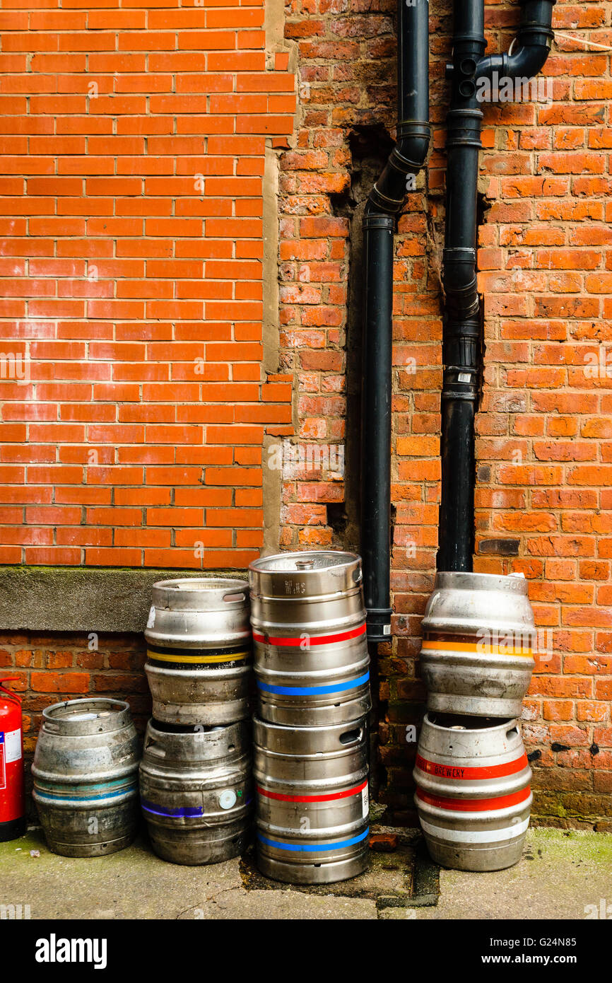 Beer casks and drainpipes in an alley in Manchester's Northern Quarter Stock Photo