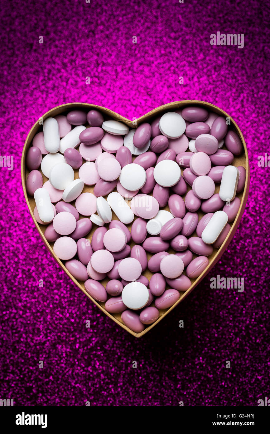 Generic pills and capsules in heart shape. Stock Photo