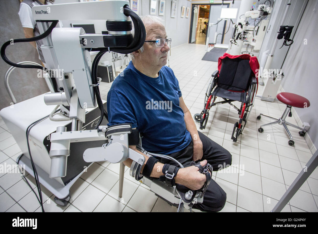 Robotic assistance to grip, Exoskeleton Armeo Power robotic arm, Clinique Saint-Roch, Cambrai, France. Stock Photo