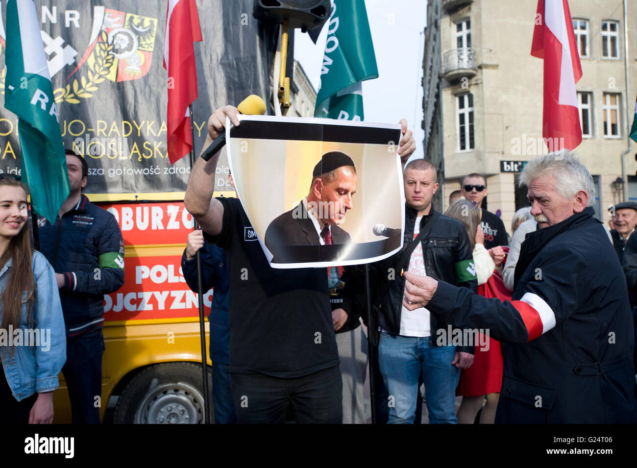 Wroclaw, Poland. 1st May, 2016. Roman Zielinski burns picture of Rafal Dutkiewicz during ONR protest in Wroclaw. Stock Photo