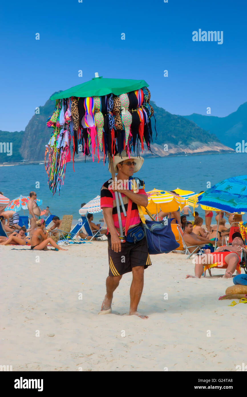 Swimsuit seller on Copacabana beach Stock Photo