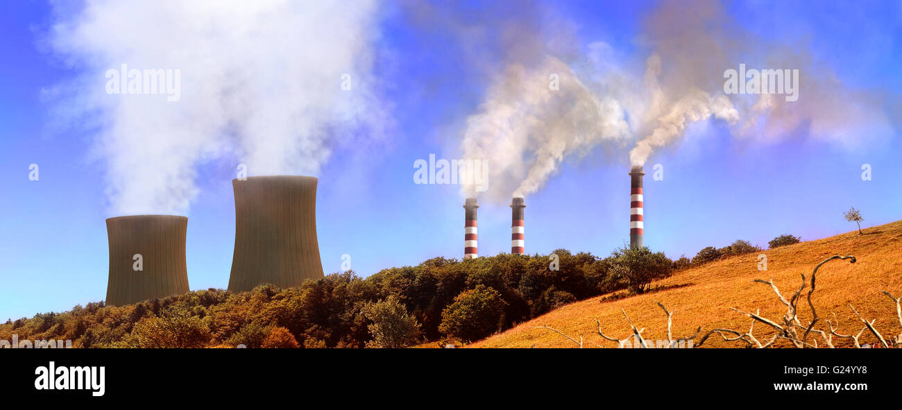 Power generating factories in the mountains. Concept of environmental pollution. Panoramic horizontal composition Stock Photo