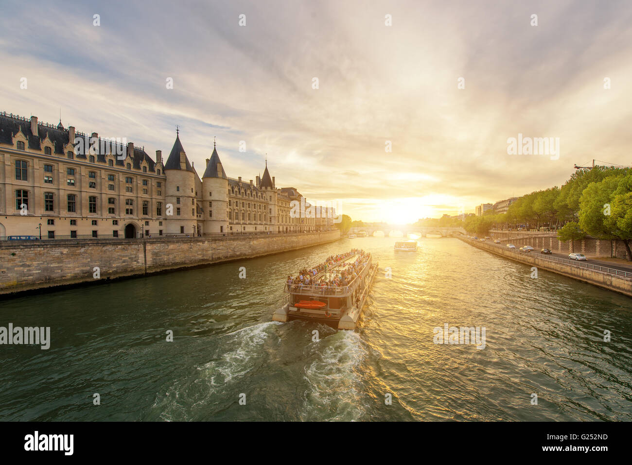 Boat tour on Seine river with sunset in Paris, France Stock Photo