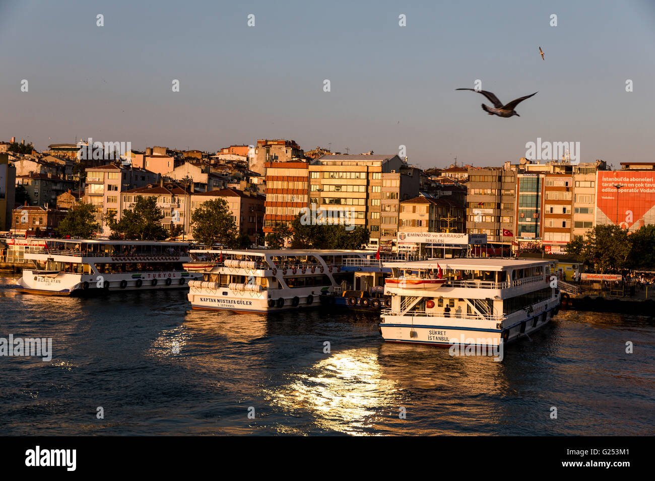 Evening mood on the Bosporus ferry under the first Bosporus bridge in Istanbul. Stock Photo