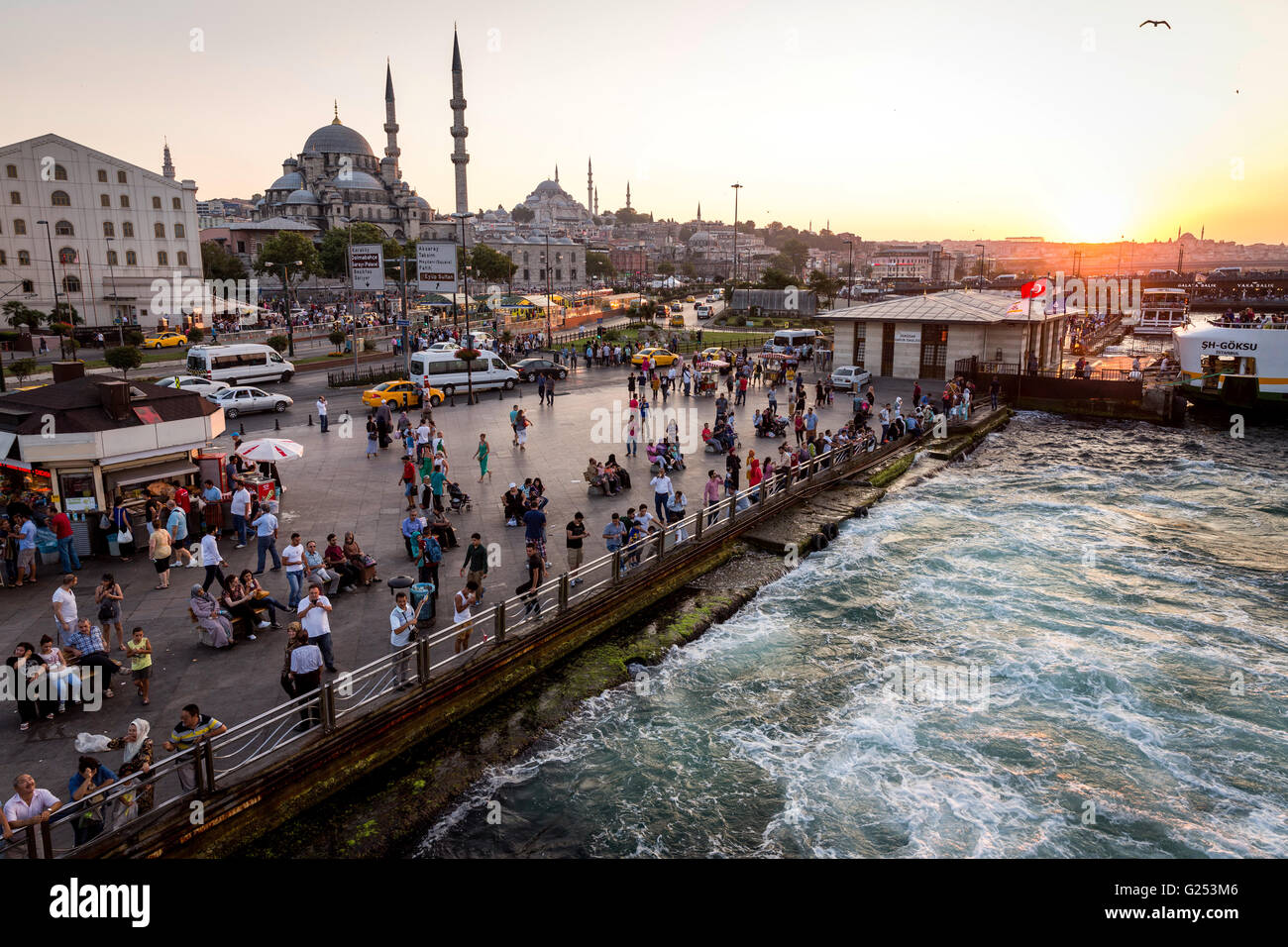Evening mood on the Bosporus ferry taking the first Bosporus bridge in Istanbul. Stock Photo