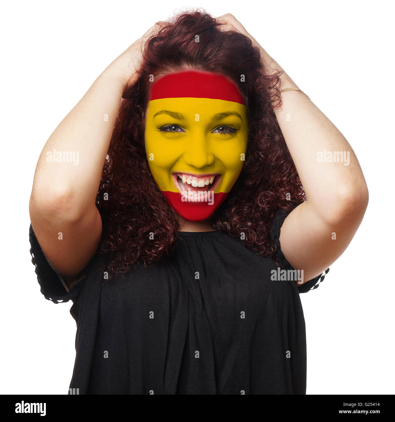 girl with spanish flag face paint Stock Photo