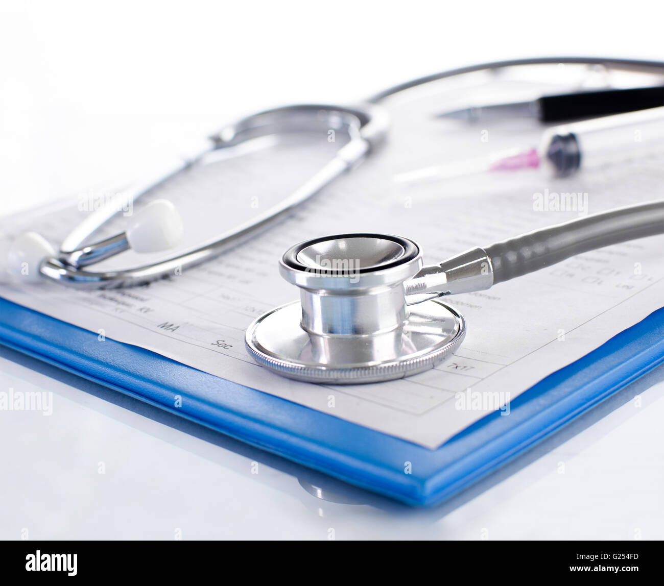 Medical history on clipboard with stethoscope on light background Stock Photo