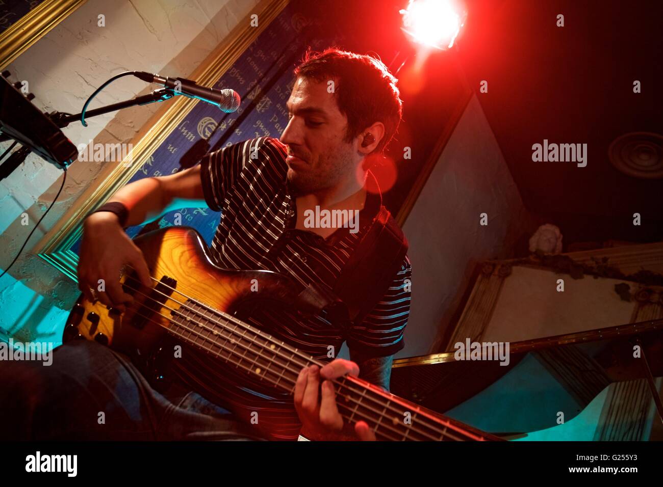Vinzenz Benjamin, a session bass player, recording in a studio, Sheffield, England Stock Photo
