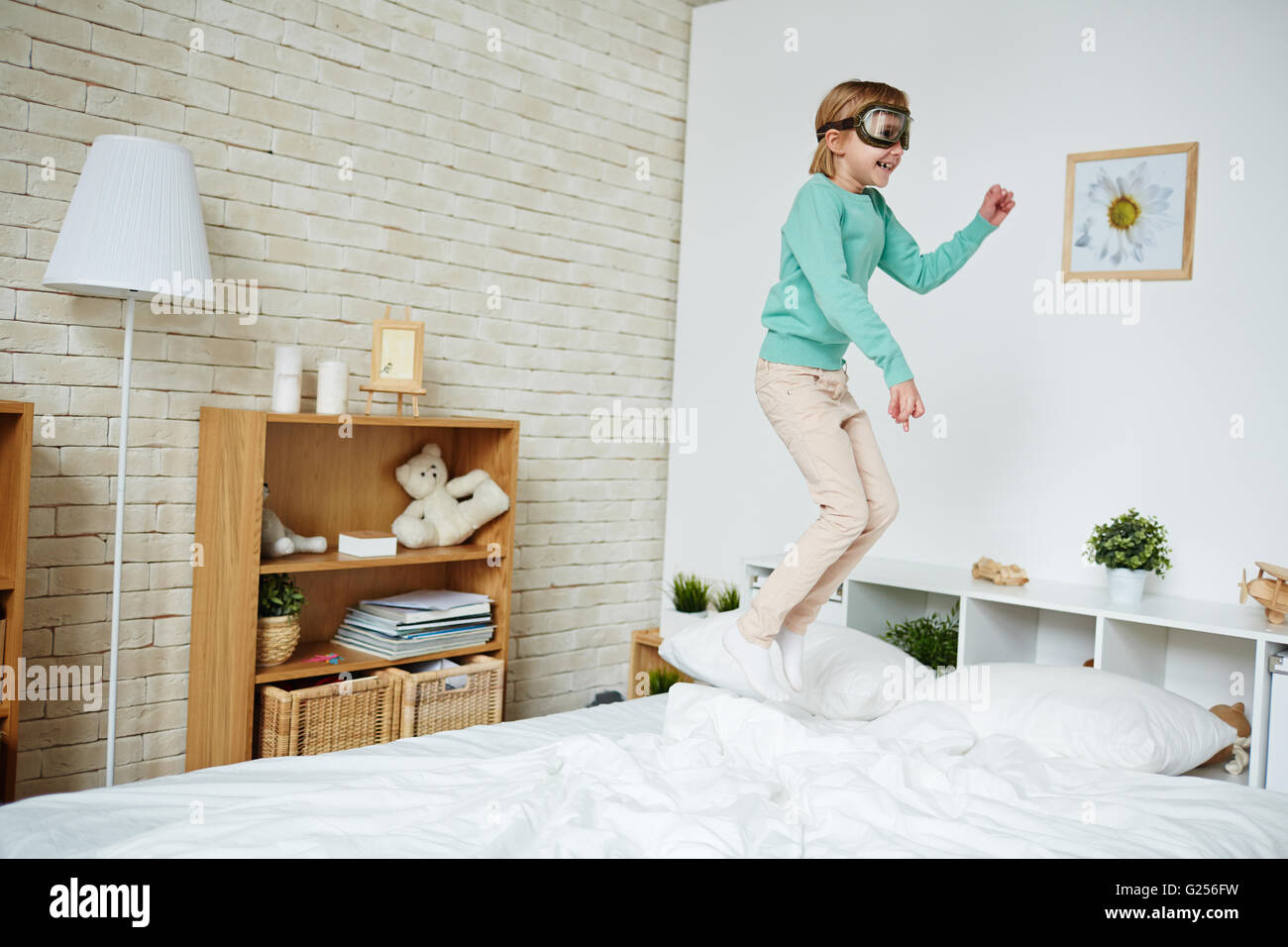 Jumping on bed Stock Photo Alamy