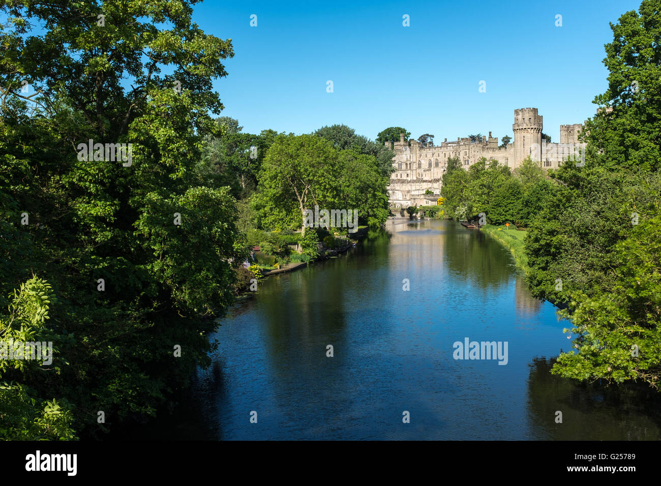 View of Warwick Castle on the River Avon on a sunny spring morning Stock Photo