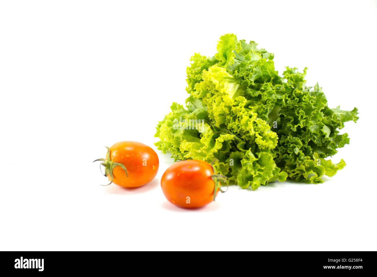 Fresh lettuce with tomatoes isolated.on white background.Vegetable
