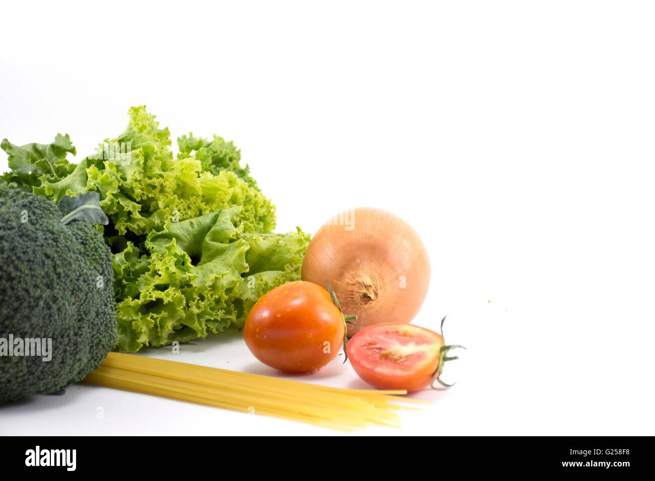 Fruits and vegetables,Lettuce, Broccoli,onion,tomatoes, spaghetti isolated.on white background