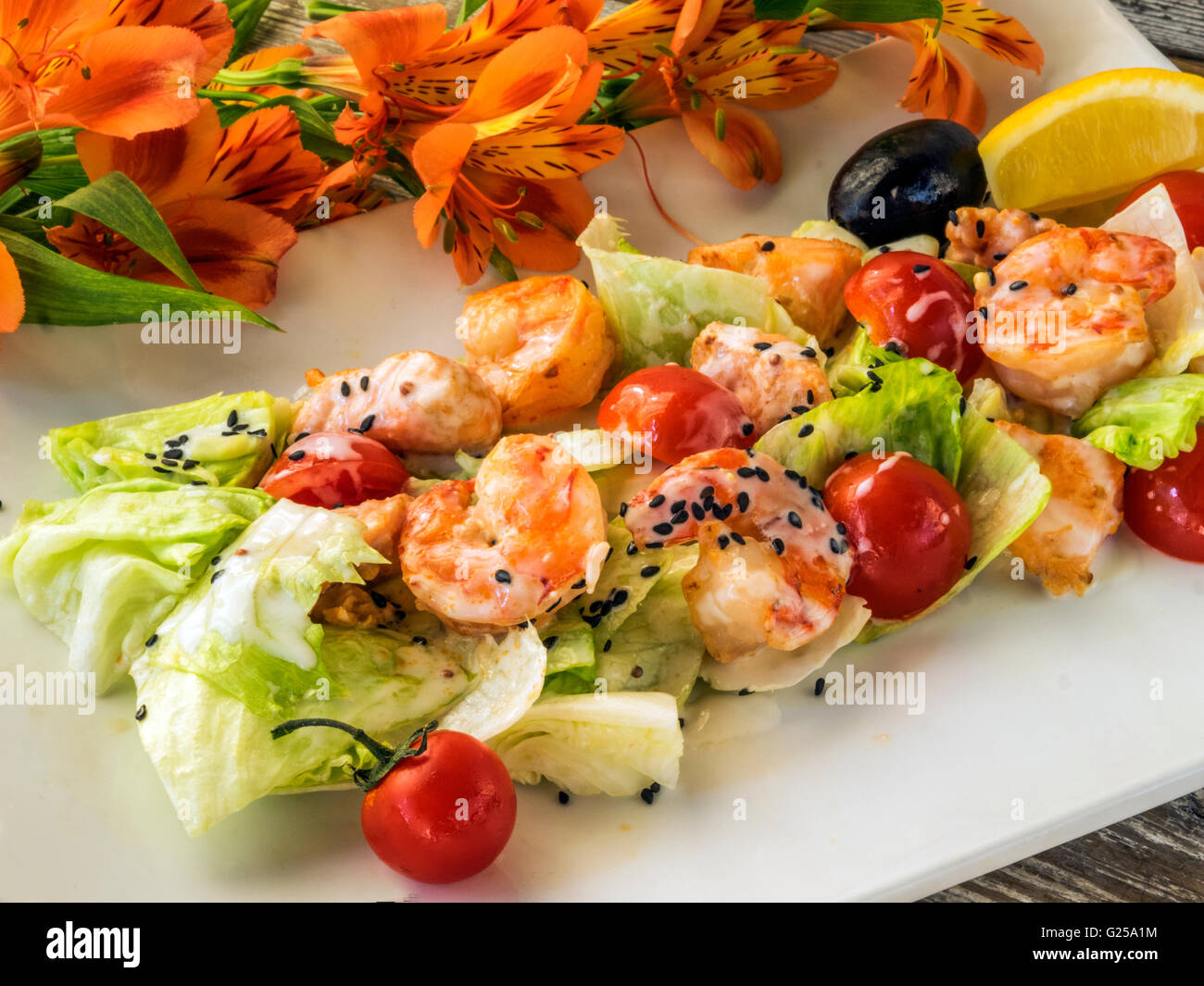 Grilled salmon and shrimp salad Stock Photo