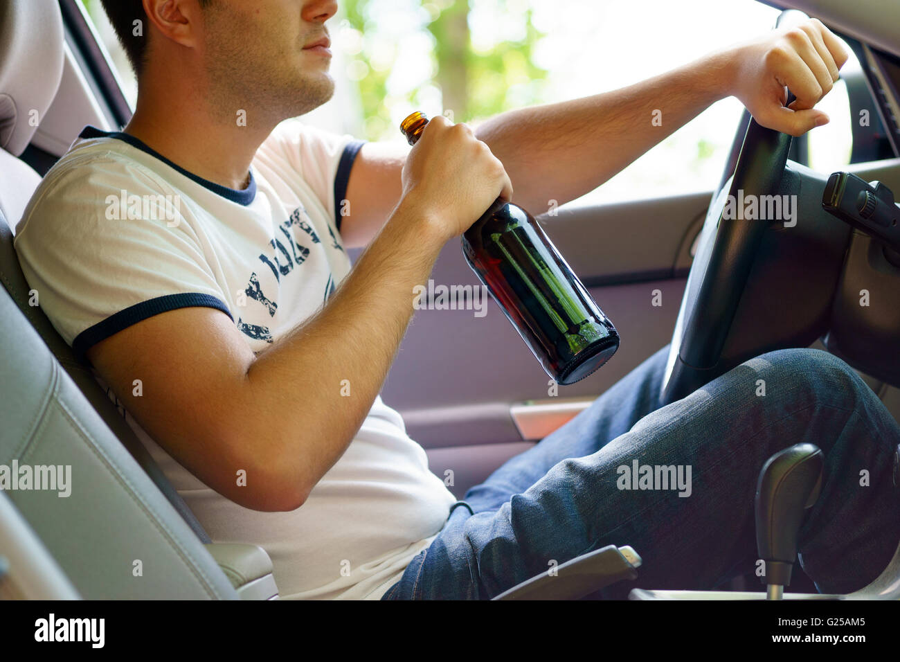 Man drinking beer while driving the car Stock Photo Alamy