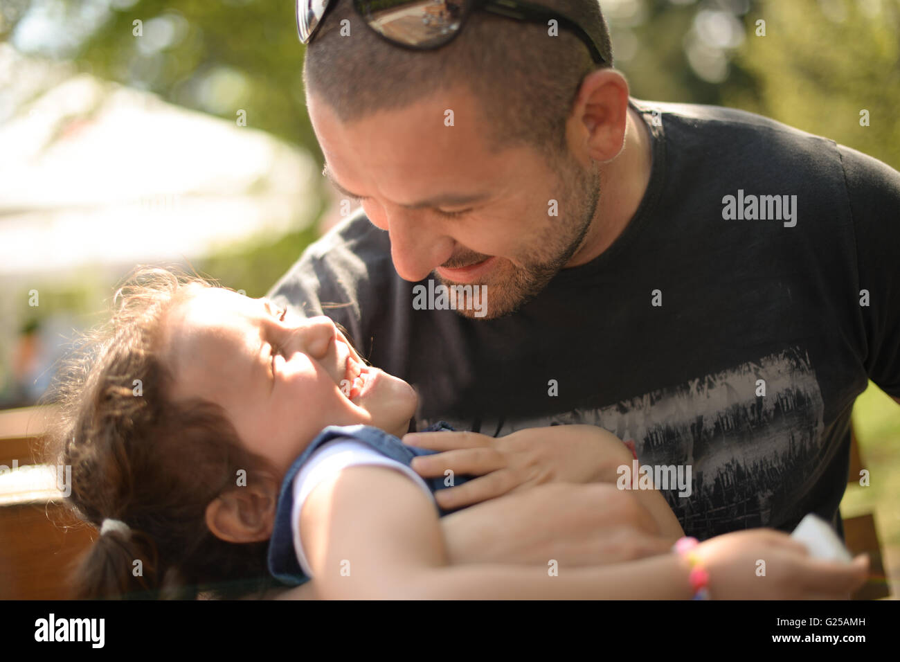 Father tickling his daughter Stock Photo