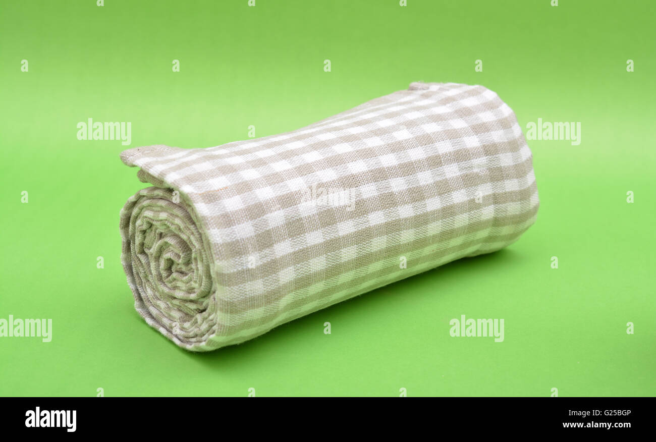 Kitchen Table Cloth Roll on Green background. Stock Photo
