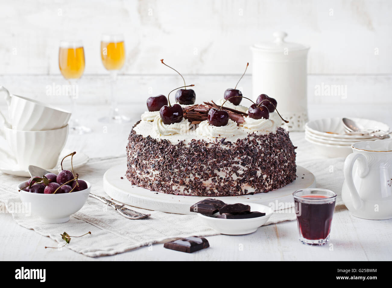 Black forest cake ,decorated with whipped cream and cherries