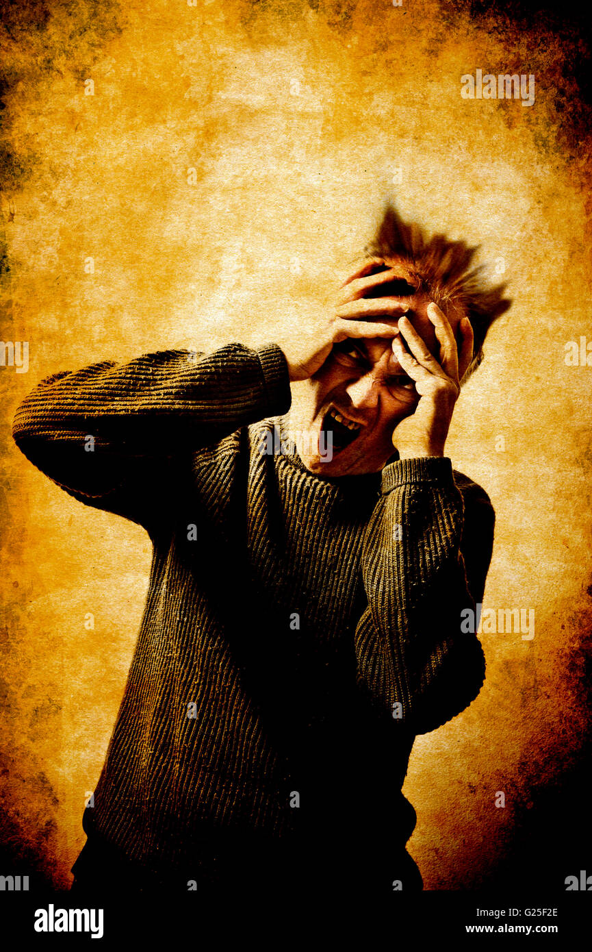 man going insane, screaming Stock Photo