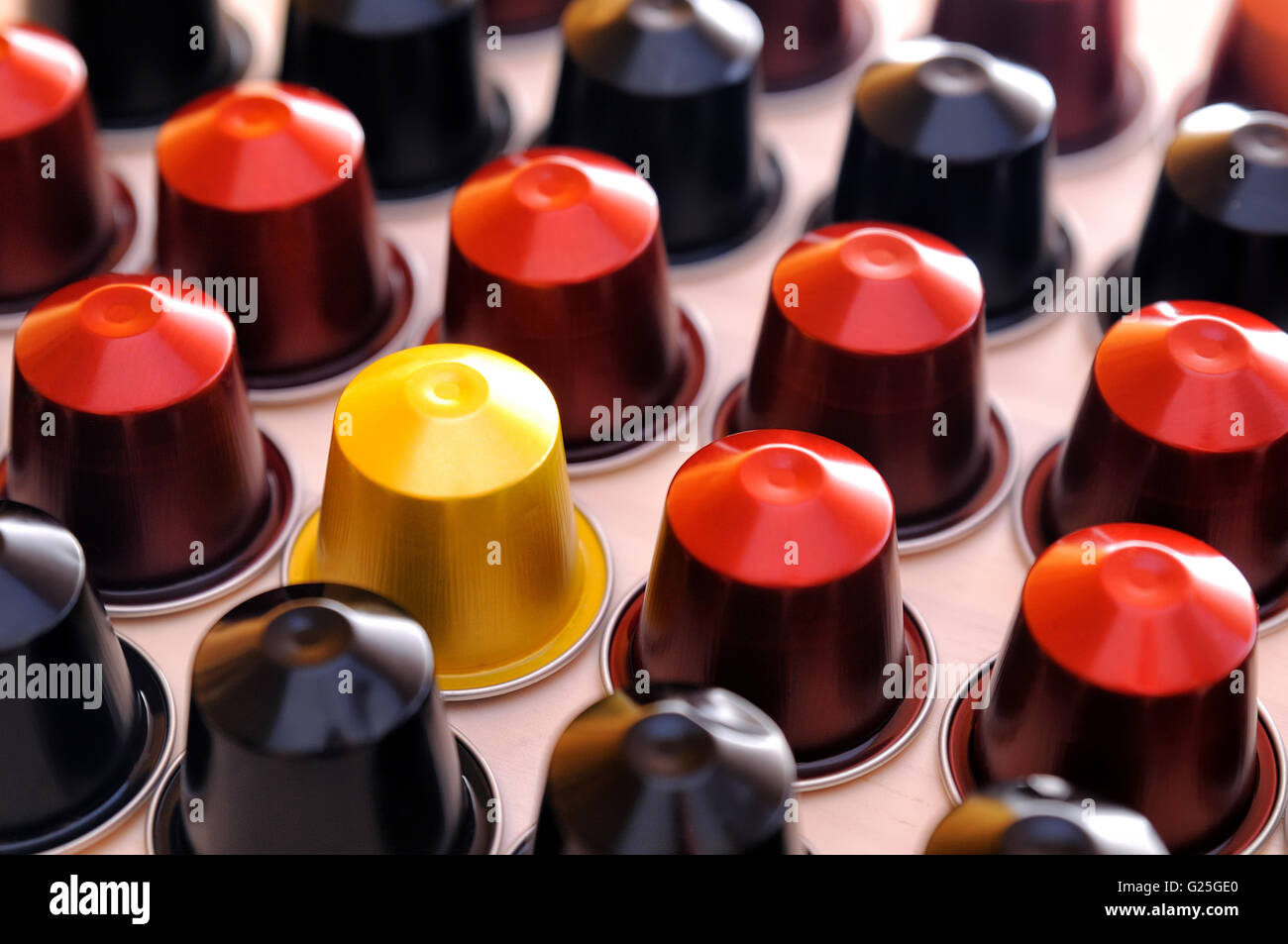 set of espresso coffee capsules for machine aligned diagonally on a table Stock Photo