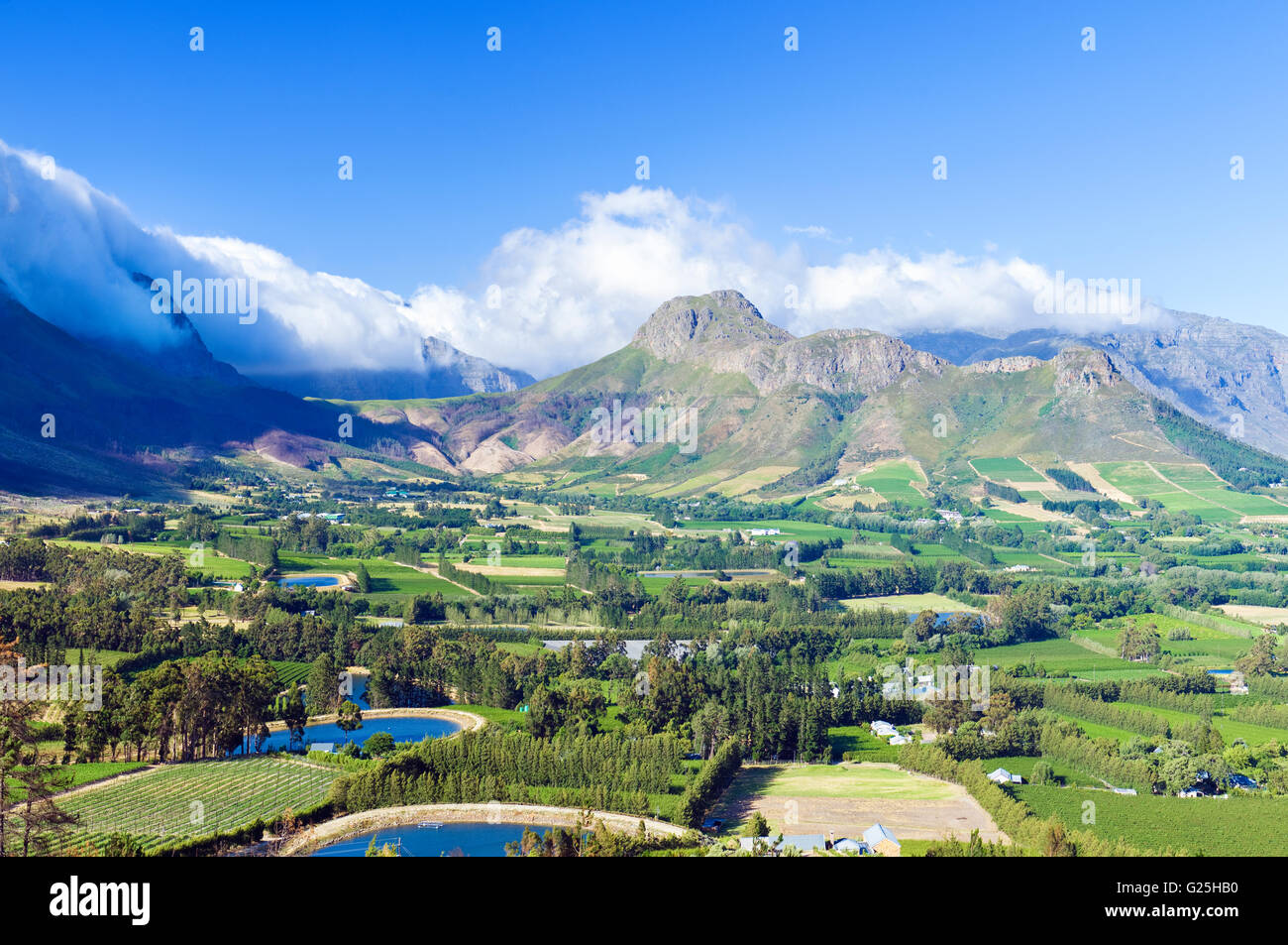 Panorama of the upper part of Franschhoek and Berg River valley with the Hottentots Holland Mountains in the background. Stock Photo