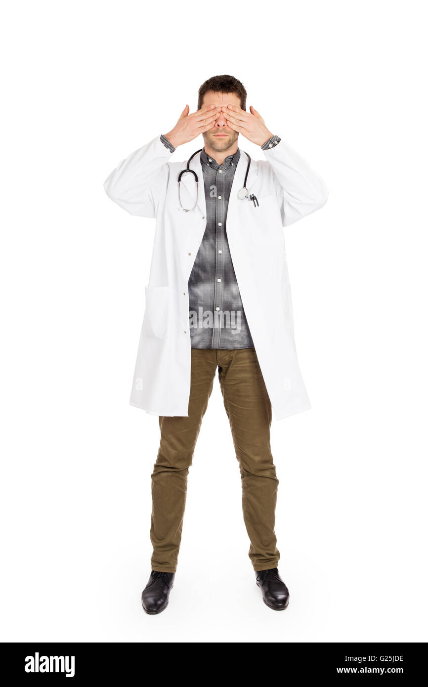 Doctor isolated on white - Sees no evil - Concept for not rocking the boat in medical circles Stock Photo