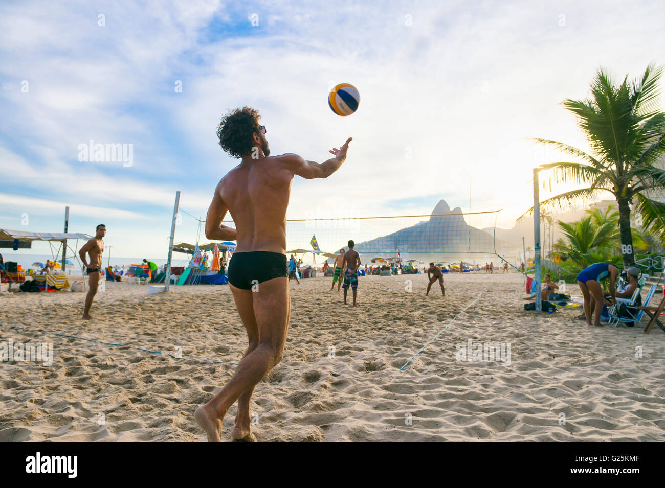 RIO DE JANEIRO - MARCH 20, 2016: Young Brazilians play beach volleyball, a sport Brazil is favored to win in the Olympic Games. Stock Photo