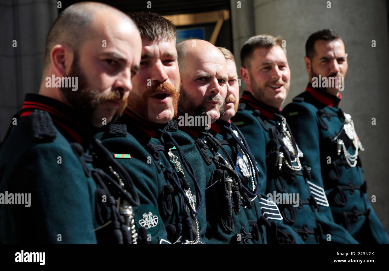 Buglers from the Massed Bands and Bugles of the Rifles gather in Curzon Street following having their beards trimmed and shaped at G.F. Trumper in Mayfair ahead of performing at Horse Guards Parade on June 1 and 2. Stock Photo