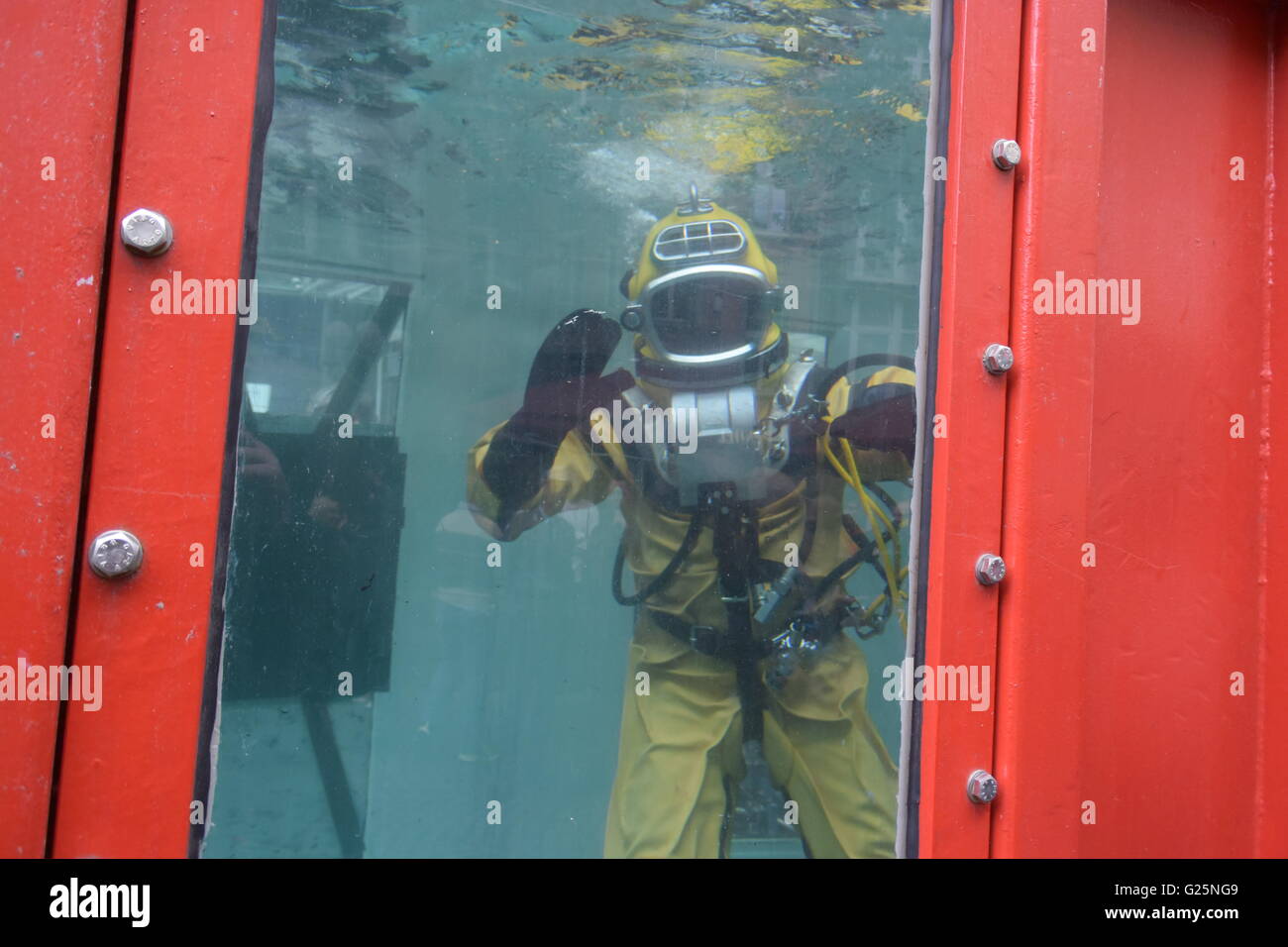 diver in a container with water Stock Photo