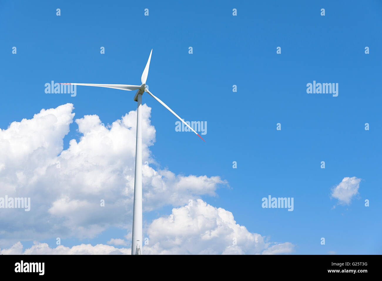 Power generation wind turbines against the blue sky with clouds Stock ...