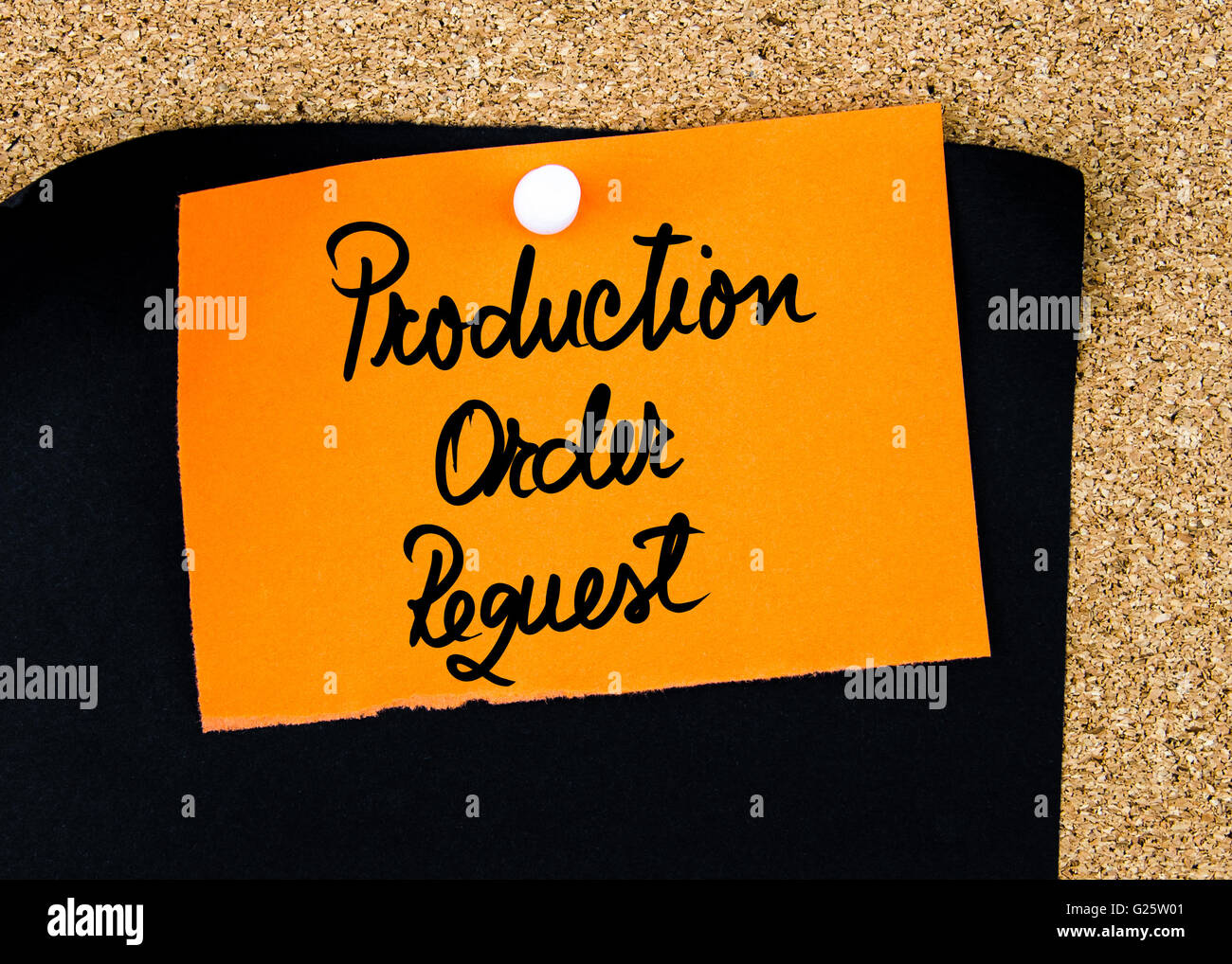 Production Order Request written on orange paper note pinned on cork ...