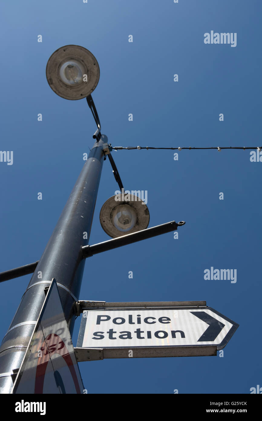 right pointing sign showing direction to a police station, new malden