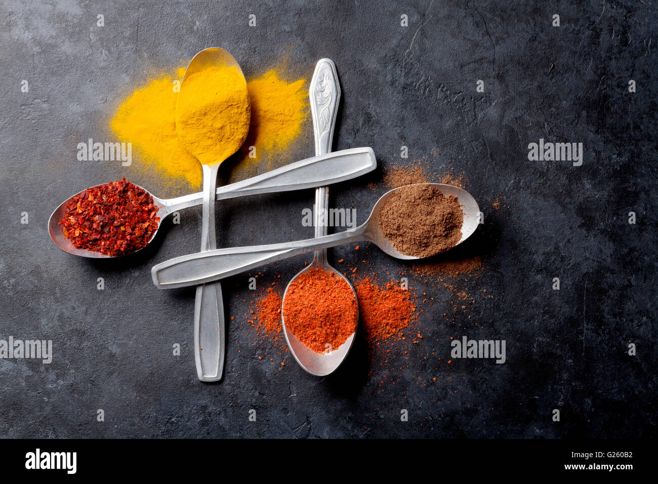Colorful spices in spoons. Top view Stock Photo