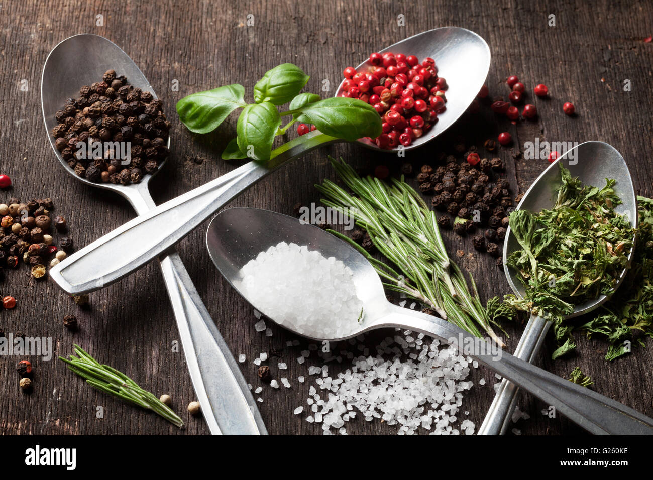 Herbs and spices on wooden table Stock Photo
