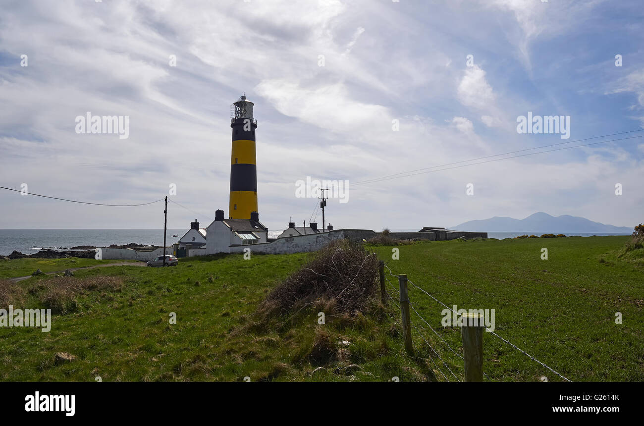 St John's Point lighthouse at Killough County Down Northern Ireland withe the Mourne mountains in the background Stock Photo