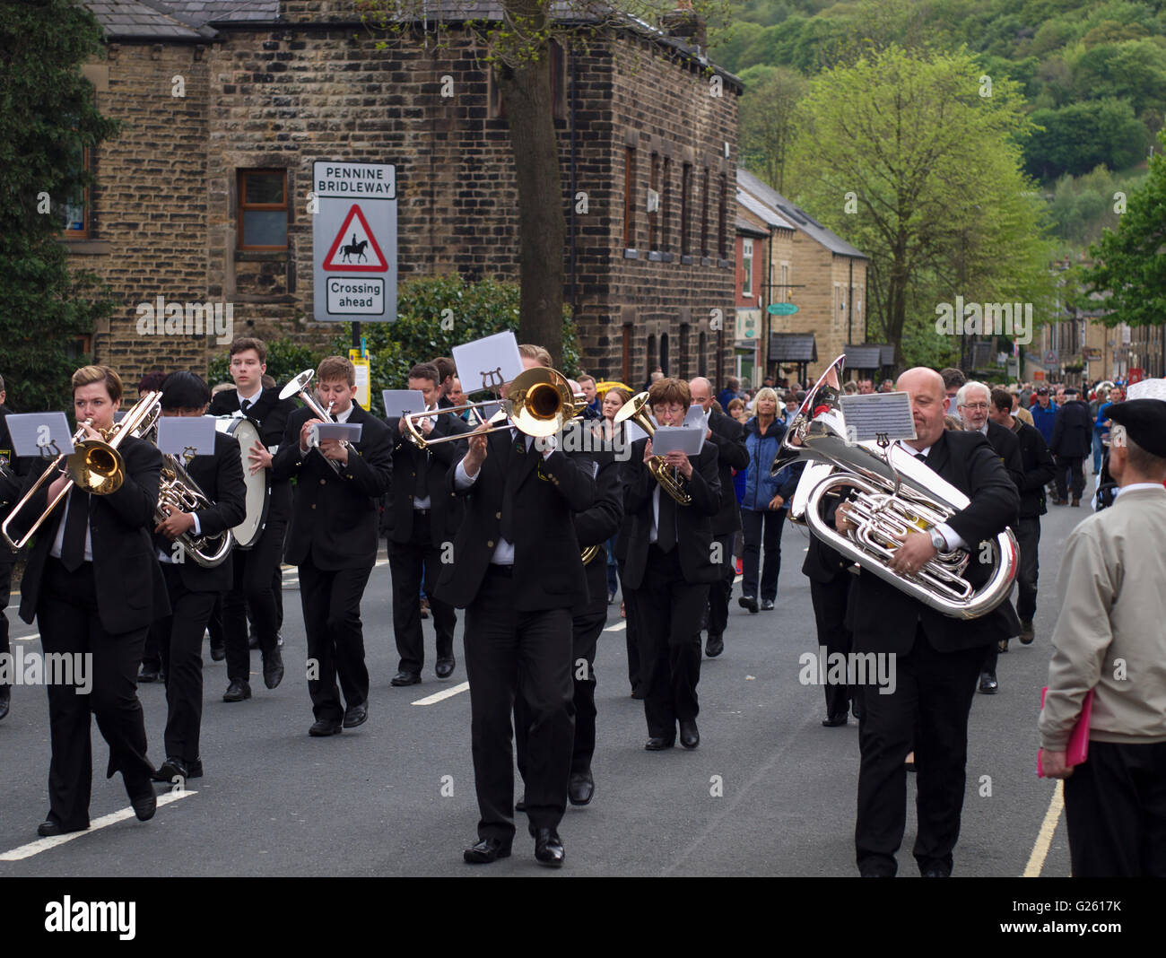 Brass band players march through Greenfield during the annual