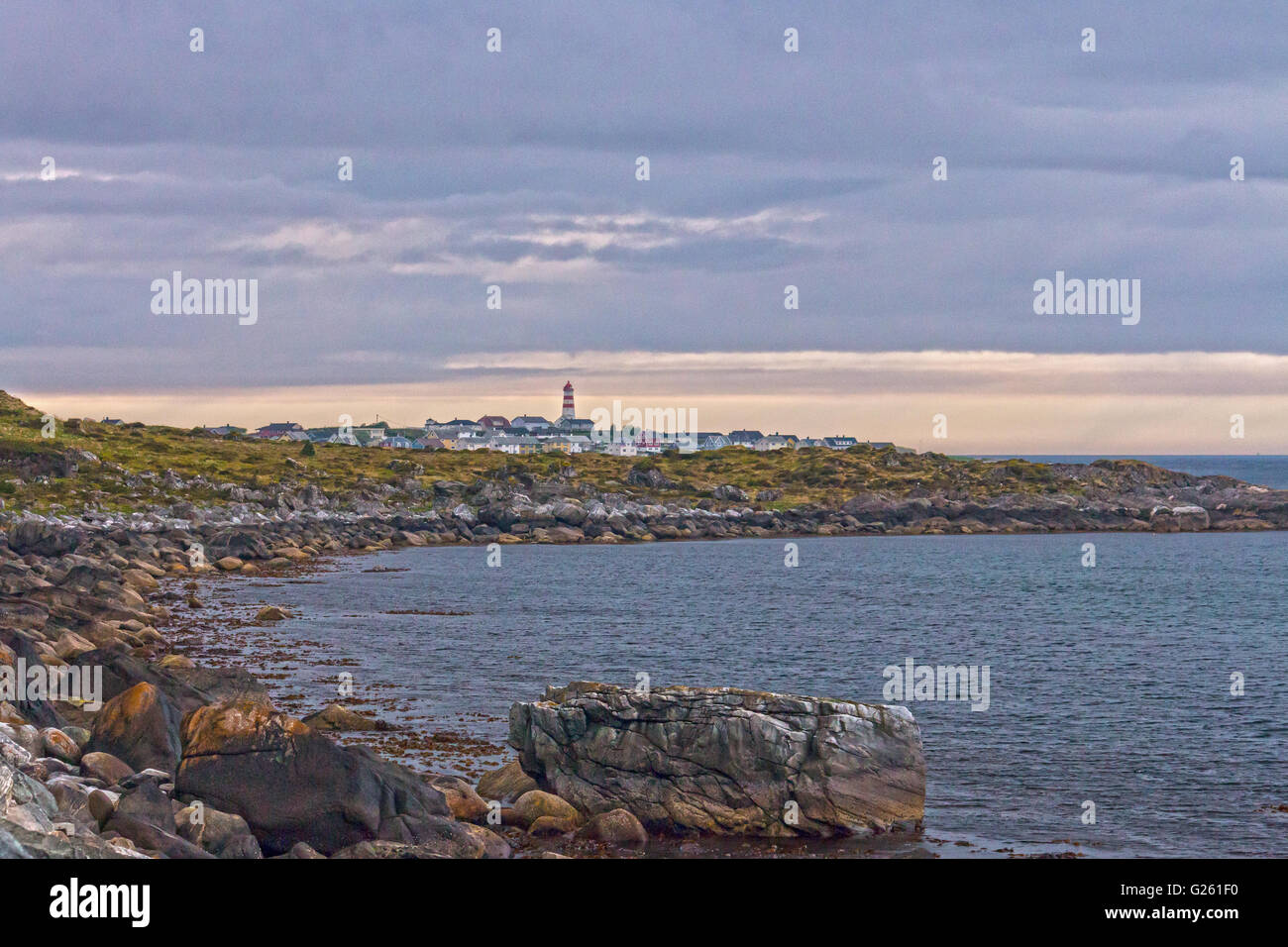 Alnes a fishing community at Godøy, Sunnmøre, Norway, harbouring one of Noway's most visited light houses. Stock Photo