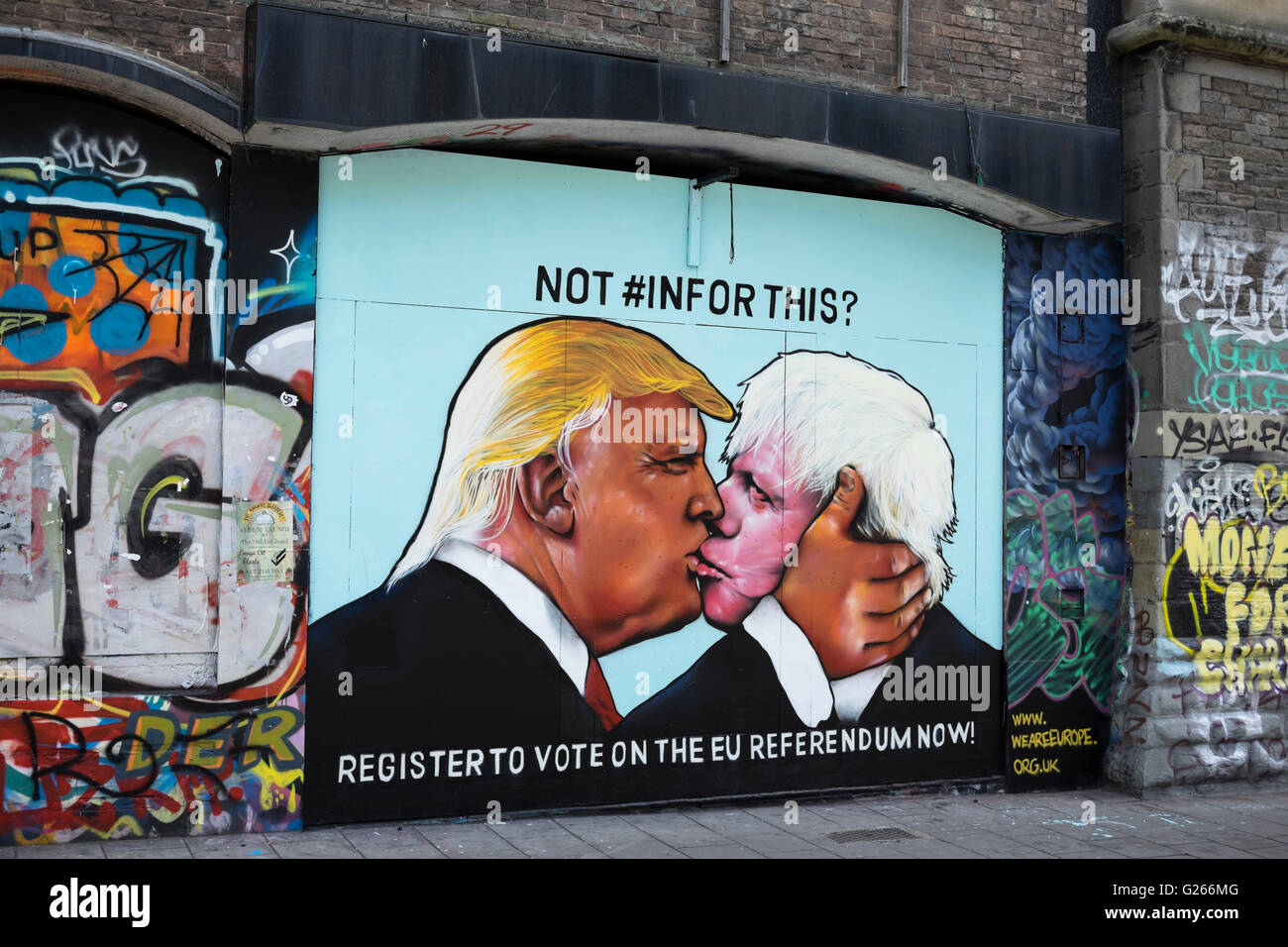 Stokes Croft, Bristol, UK. 24th May, 2016. Stokes Croft is an area of Bristol known for its grafitti. The latest addition is this image of US presidential hopefull Donald Trump and UK 'Brexit' campaignerr Boris Johnson in an embrace. A message explains the importance of registering to vote in the forthcoming UK EU referendum. Credit:  Mr Standfast/Alamy Live News Stock Photo