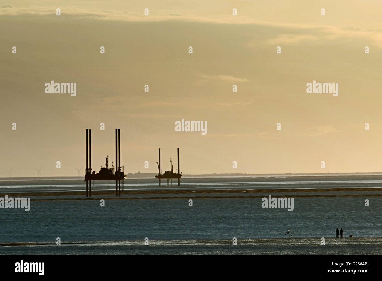 Morecambe Bay, UK. 24th May, 2016. National Grid jack leg drilling Barges are currently undertaking survey work in Morecambe Bay as proposals are developed ahead of this year’s public consultation on the North West Coast Connections project. The work could influence the proposed routing of tunnel that will carry the high voltage DC cable across the Bay which will connect the proposed Nuclear Power Station at Moorside in Cumbria to the National Grid at Middleton Sands Substation at Heysham. Credit:  David Billinge/Alamy Live News Stock Photo