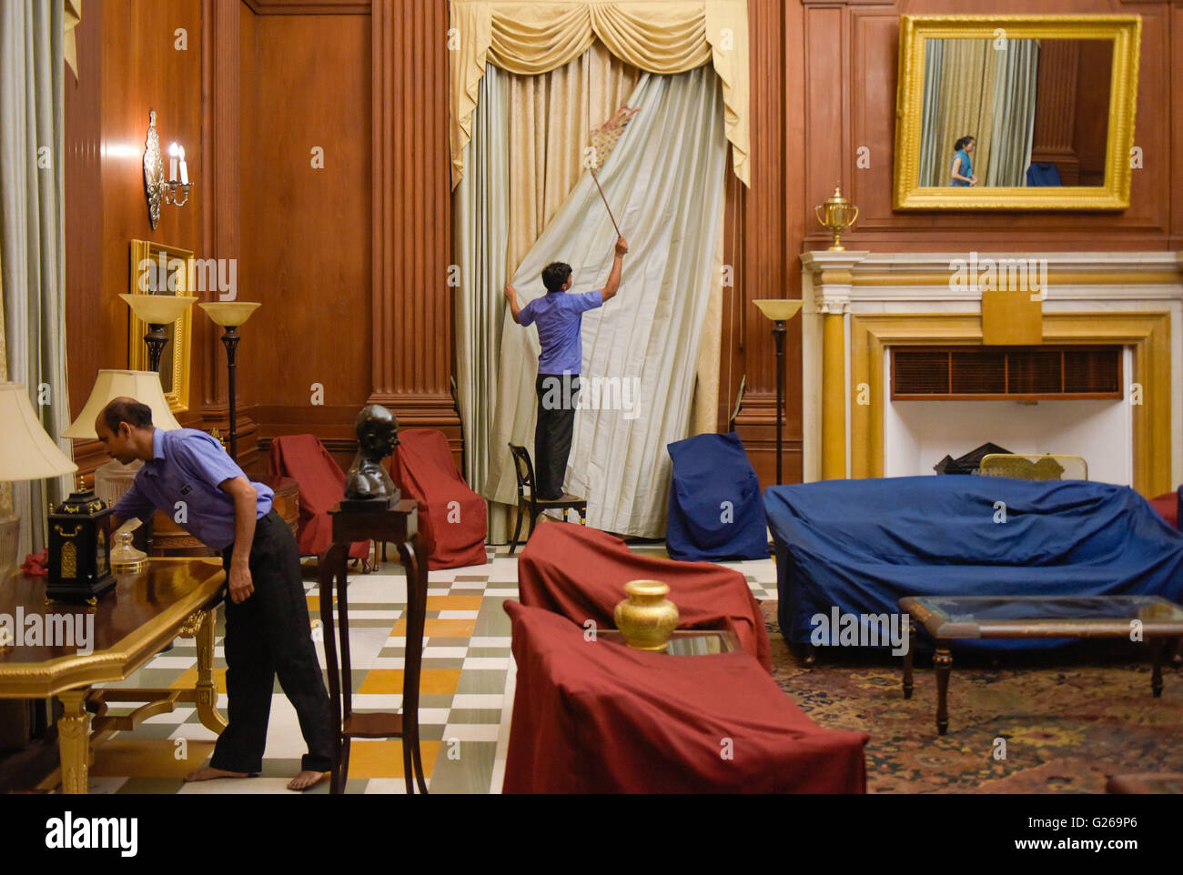 (160525) -- EW DELHI, May 25, 2016 (Xinhua) -- Janitors clean a room used for meetings with visiting foreign leaders at the Rashtrapati Bhavan in New Delhi, India, May 22, 2016. Rashtrapati Bhavan, or Presidential Residence of India, locates on the Raisina Hill in the capital city. Designed by Britain architect Sir Edwin Lutyens as the home of the Viceroys of India in 1921 and completed in 1929, the building contains over 2.4 km corridors, 340 rooms and 227 columns. In the year 1950 it was renamed as Rashtrapati Bhavan when Rajendra Prasad became the first President of India and occupied this  Stock Photo