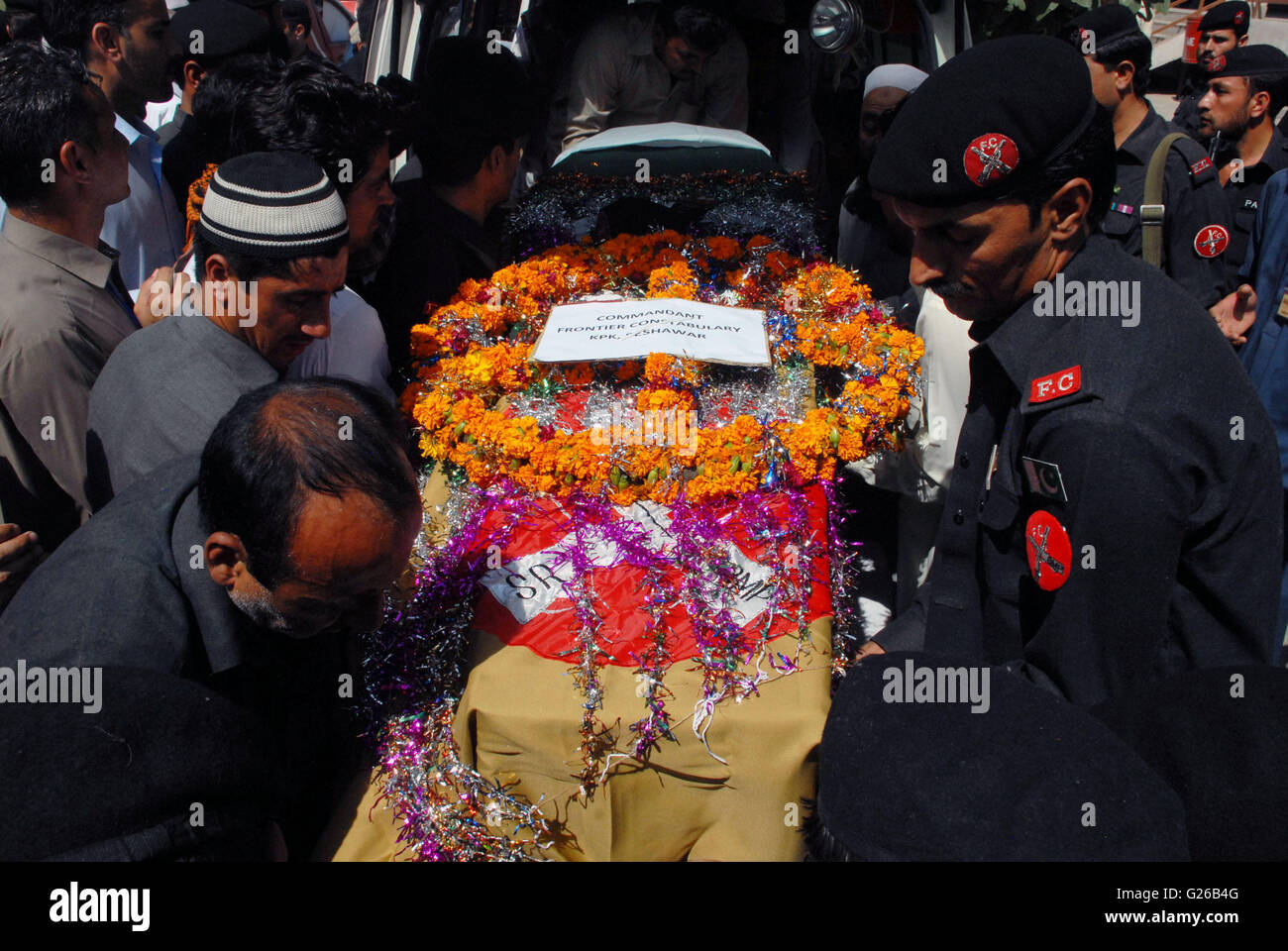 Peshawar. 25th May, 2016. People carry a coffin on the funeral ceremony