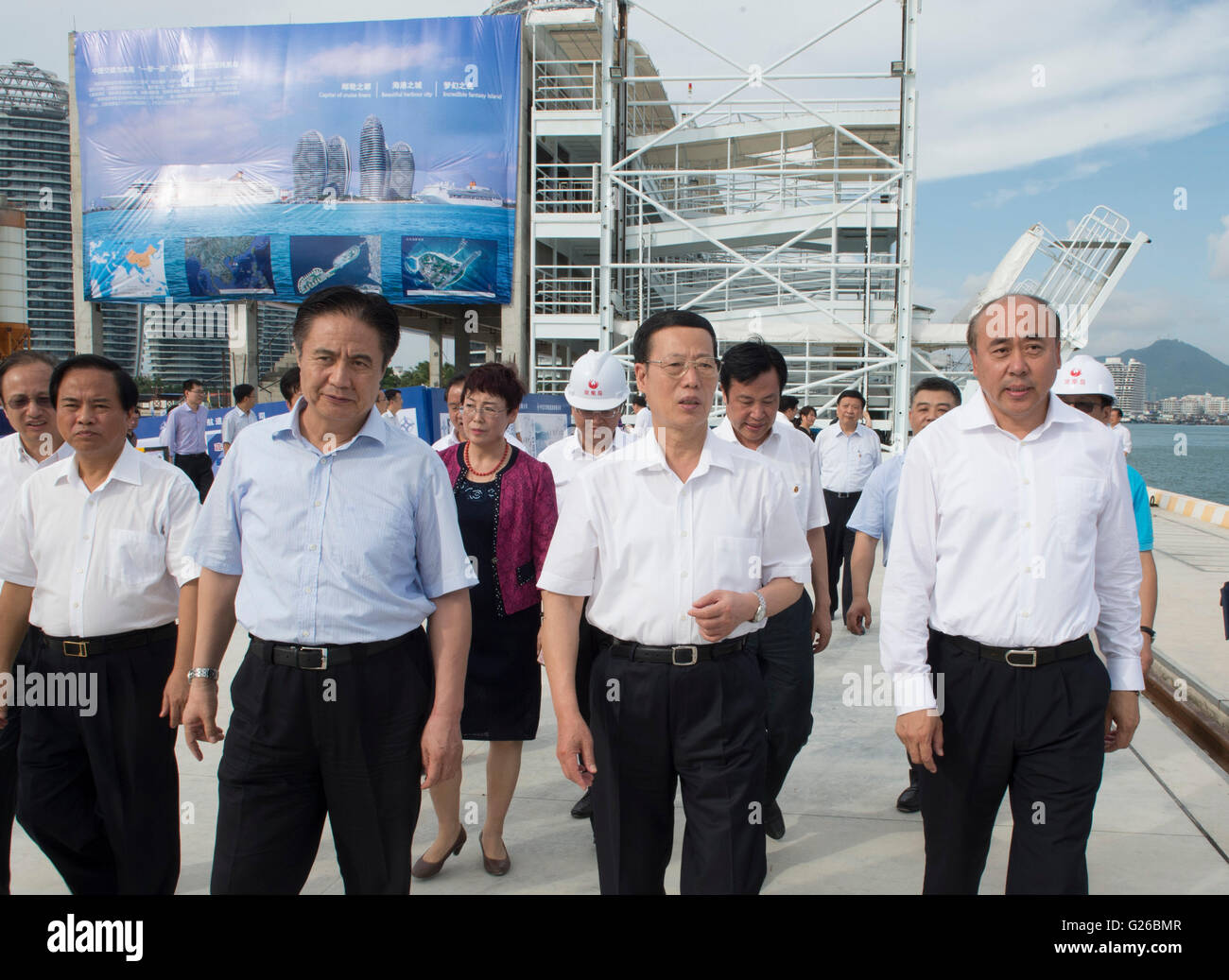 Beijing, China's Hainan Province. 24th May, 2016. Chinese Vice Premier Zhang Gaoli (C front) inspects a construction site of the second-phase of an international harbor in Fenghuang Island in Sanya, south China's Hainan Province, May 24, 2016. Zhang made an inspection tour in Jiangxi and Hainan from May 23 to 25. Credit:  Wang Ye/Xinhua/Alamy Live News Stock Photo