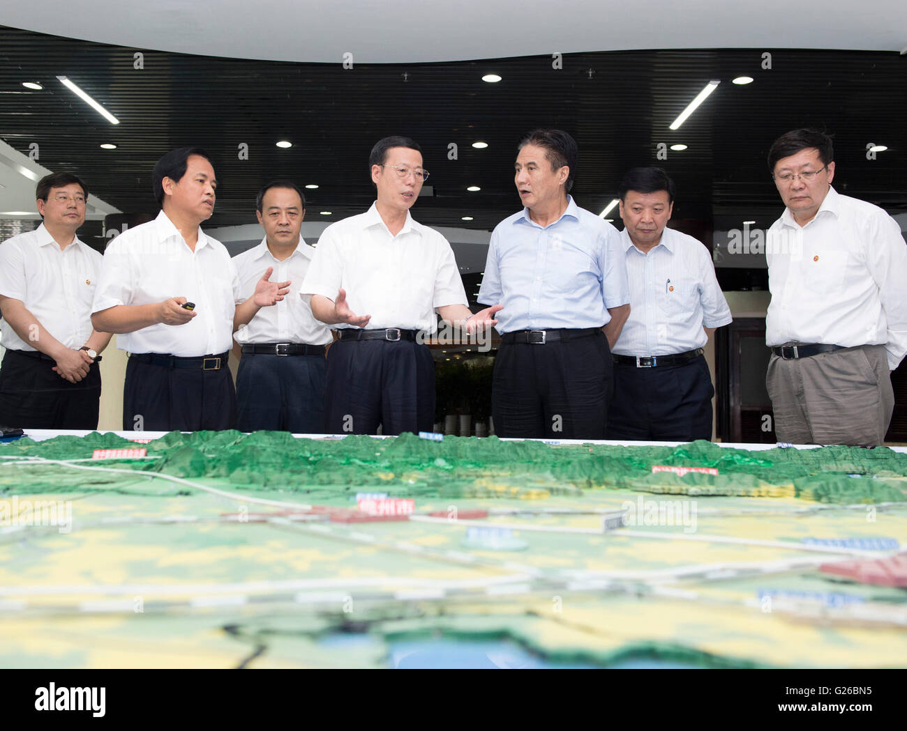 Beijing, China's Hainan Province. 24th May, 2016. Chinese Vice Premier Zhang Gaoli (C) inspects the Fenghuang Island International Harbor in Sanya, south China's Hainan Province, May 24, 2016. Zhang made an inspection tour in Jiangxi and Hainan from May 23 to 25. Credit:  Wang Ye/Xinhua/Alamy Live News Stock Photo