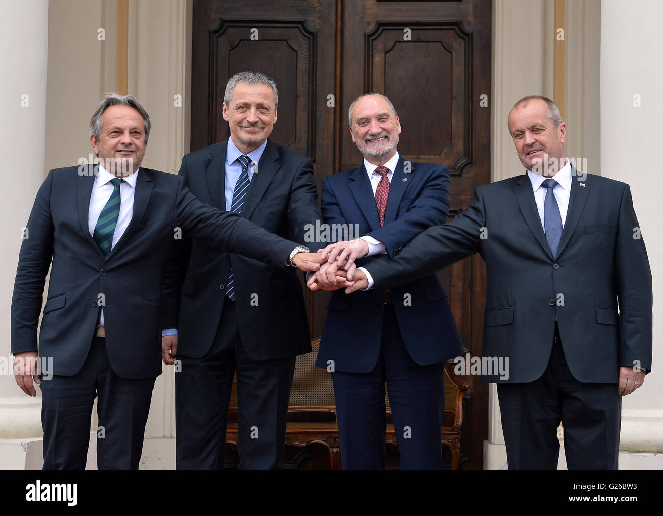 Liblice, Czech Republic. 25th May, 2016. From left to right, Hungarian Defense Minister Tomas Vargha, Czech Defense Minister Martin Stropnicky, Polish Defense Minister Antoni Macierewicz and Slovak Defense Minister Peter Gajdos pose for photo during a meeting of defense ministers of the Visegrad Group at the chateau in Liblice, Czech Republic, May 25, 2016. Credit:  Katerina Sulova/CTK Photo/Alamy Live News Stock Photo