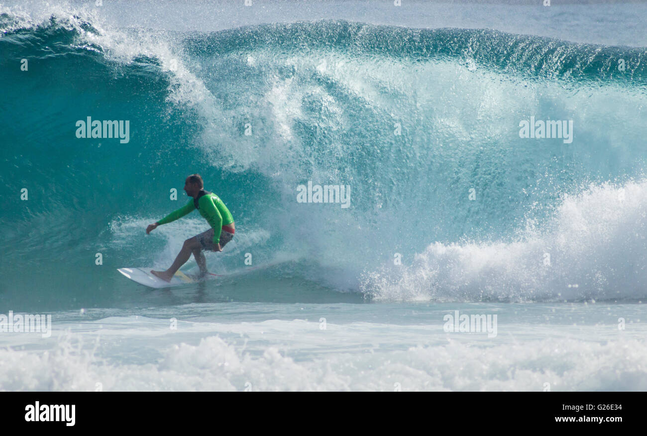 Las Palmas, Gran Canaria, Canary Islands, Spain, 25th May 2016. Weather: A surfer rides a huge wave at El Confital beach on a glorious afternoon in Las Palmas the Capital of Gran Canaria. Credit:  Alan Dawson News/Alamy Live News Stock Photo